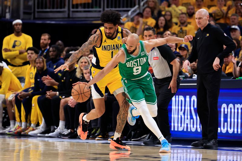 INDIANAPOLIS, INDIANA - MAY 27: Derrick White #9 of the Boston Celtics steals the ball from Obi Toppin #1 of the Indiana Pacers during the third quarter in Game Four of the Eastern Conference Finals at Gainbridge Fieldhouse on May 27, 2024 in Indianapolis, Indiana. NOTE TO USER: User expressly acknowledges and agrees that, by downloading and or using this photograph, User is consenting to the terms and conditions of the Getty Images License Agreement. (Photo by Justin Casterline/Getty Images)