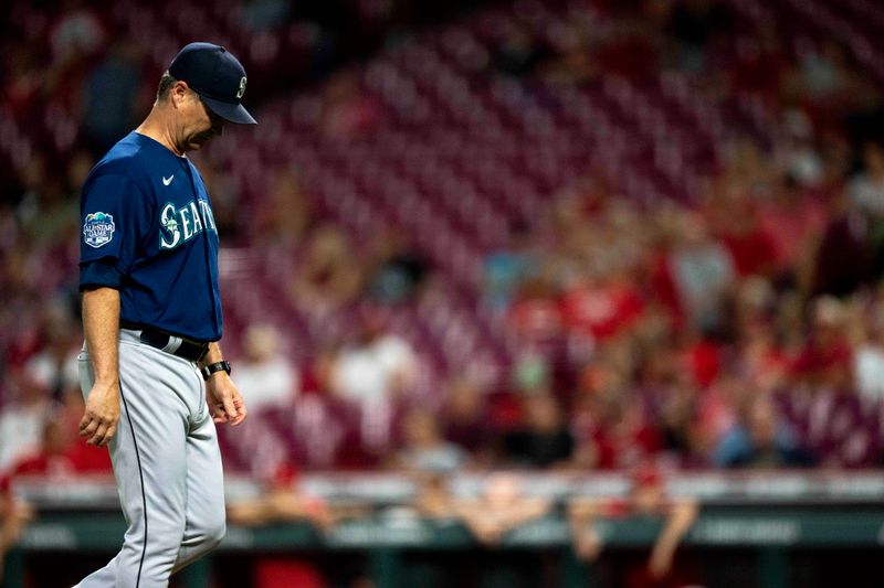 Sep 6, 2023; Cincinnati, Ohio, USA; Seattle Mariners manager Scott Servais (9) walks back to the dugout in the eighth inning of the MLB baseball game between the Cincinnati Reds and the Seattle Mariners at Great American Ball Park. Mandatory Credit: Albert Cesare-USA TODAY Sports