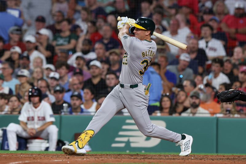 Jul 10, 2024; Boston, Massachusetts, USA; Oakland Athletics center fielder JJ Bleday (33) hits an RBI double during the seventh inning against the Boston Red Sox at Fenway Park. Mandatory Credit: Paul Rutherford-USA TODAY Sports