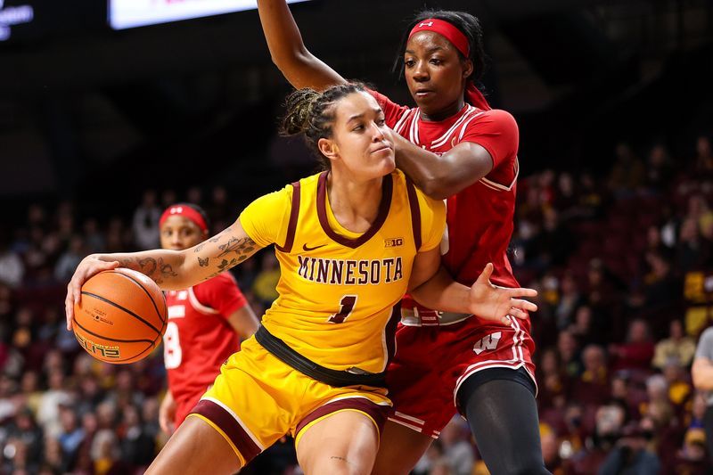 Feb 20, 2024; Minneapolis, Minnesota, USA; Minnesota Golden Gophers forward Ayianna Johnson (1) works towards the basket as Wisconsin Badgers forward Serah Williams (25) defends during the first half at Williams Arena. Mandatory Credit: Matt Krohn-USA TODAY Sports