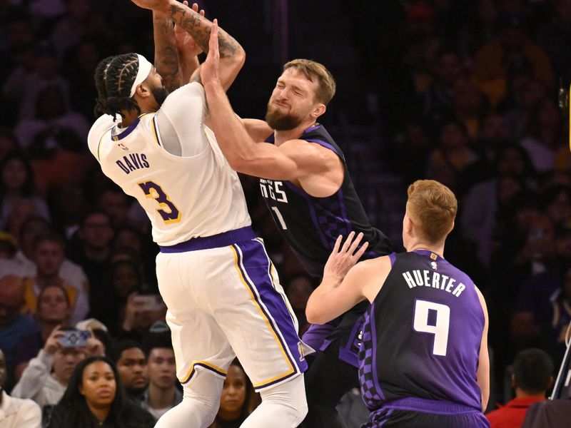 LOS ANGELES, CALIFORNIA - OCTOBER 26: Anthony Davis #3 of the Los Angeles Lakers shoots over Domantas Sabonis #11 of the Sacramento Kings at Crypto.com Arena on October 26, 2024 in Los Angeles, California. NOTE TO USER: User expressly acknowledges and agrees that, by downloading and or using this photograph, User is consenting to the terms and conditions of the Getty Images License Agreement. (Photo by John McCoy/Getty Images)