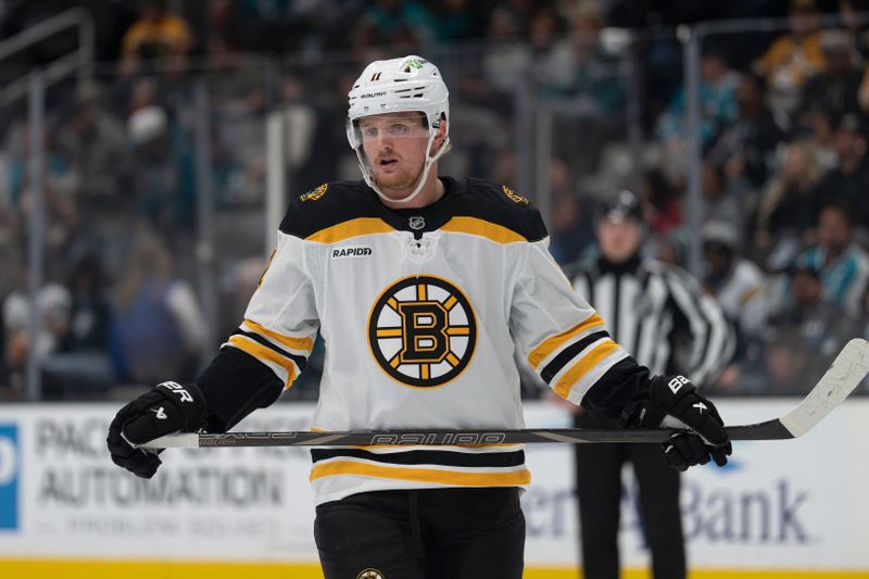 Mar 22, 2025; San Jose, California, USA;  Boston Bruins center Casey Mittelstadt (11) during the first period against the San Jose Sharks at SAP Center at San Jose. Mandatory Credit: Stan Szeto-Imagn Images