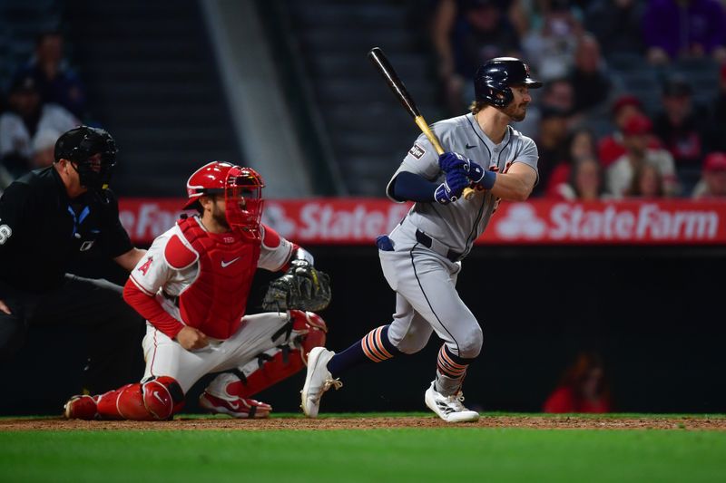 May 1, 2025; Anaheim, California, USA; Detroit Tigers left fielder Zach McKinstry (39) hits an RBI single against the Los Angeles Angels during the eighth inning at Angel Stadium. Mandatory Credit: Gary A. Vasquez-Imagn Images