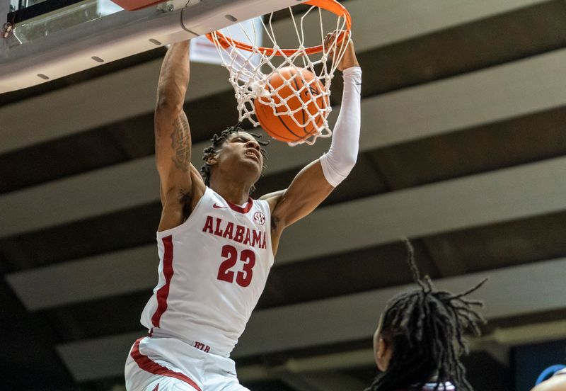 Jan 25, 2023; Tuscaloosa, Alabama, USA; Alabama Crimson Tide forward Nick Pringle (23) dunks the ball against the Mississippi State Bulldogs during the first half at Coleman Coliseum. Mandatory Credit: Marvin Gentry-USA TODAY Sports