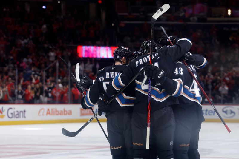 Jan 18, 2025; Washington, District of Columbia, USA; Washington Capitals defenseman Jakob Chychrun (6) celebrates with teammates after scoring a goal against the Pittsburgh Penguins in the first period at Capital One Arena. Mandatory Credit: Geoff Burke-Imagn Images