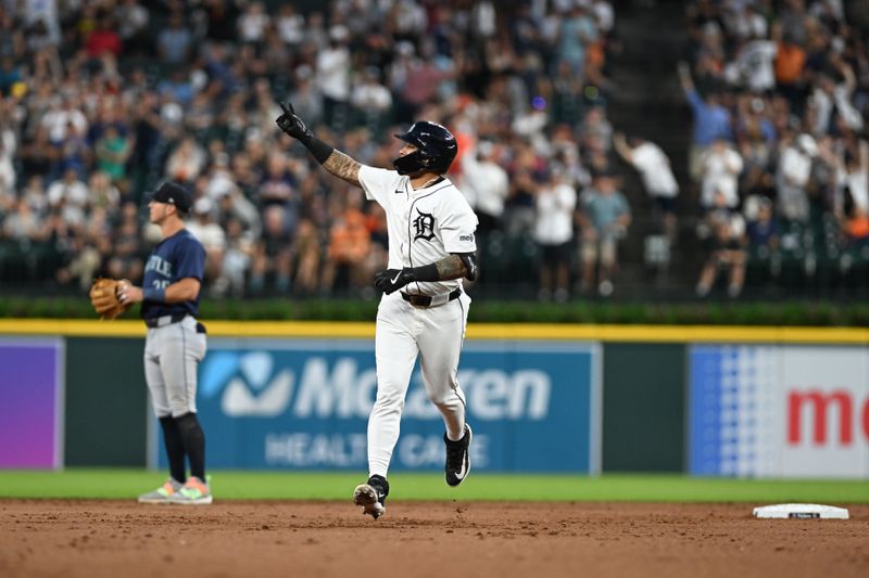 Aug 13, 2024; Detroit, Michigan, USA;  Detroit Tigers shortstop Javier Baez (28) celebrates as he rounds the bases after hitting a solo home run against the Seattle Mariners in the sixth inning at Comerica Park. Mandatory Credit: Lon Horwedel-USA TODAY Sports