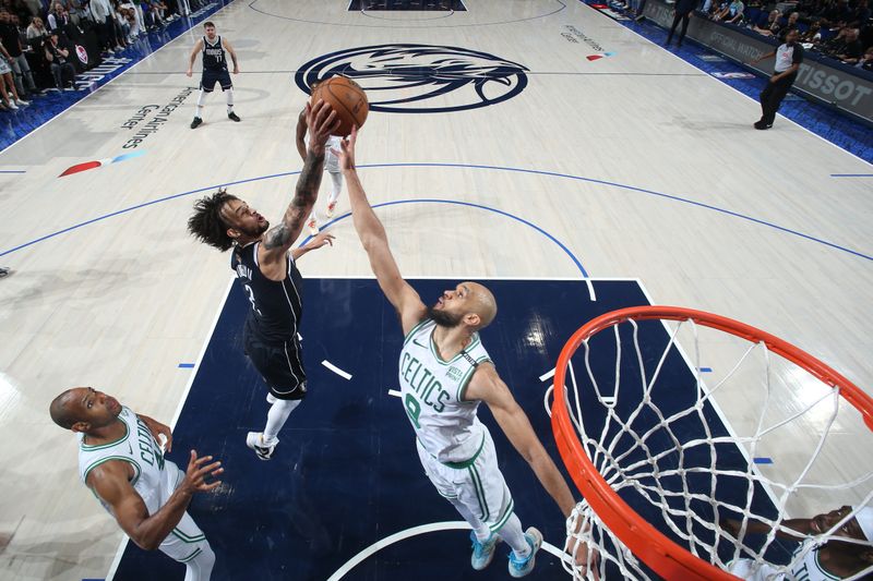 DALLAS, TX - JUNE 12: Dereck Lively II #2 of the Dallas Mavericks and Derrick White #9 of the Boston Celtics go up for the rebound during the game during Game 3 of the 2024 NBA Finals on June 12, 2024 at the American Airlines Center in Dallas, Texas. NOTE TO USER: User expressly acknowledges and agrees that, by downloading and or using this photograph, User is consenting to the terms and conditions of the Getty Images License Agreement. Mandatory Copyright Notice: Copyright 2024 NBAE (Photo by Nathaniel S. Butler/NBAE via Getty Images)