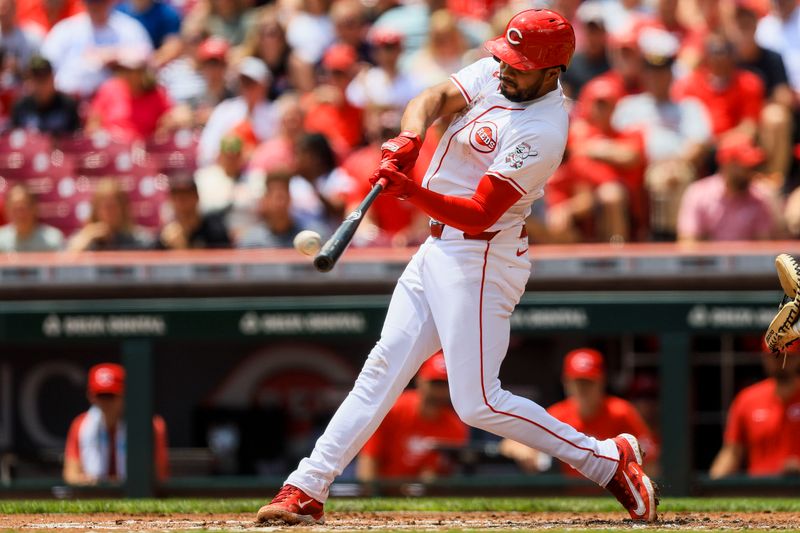 May 23, 2024; Cincinnati, Ohio, USA; Cincinnati Reds third baseman Jeimer Candelario (3) hits a RBI triple in the first inning against the San Diego Padres at Great American Ball Park. Mandatory Credit: Katie Stratman-USA TODAY Sports