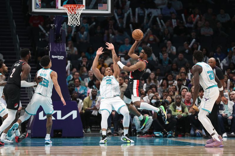 CHARLOTTE, NC - APRIL 3:  Scoot Henderson #00 of the Portland Trail Blazers drives to the basket during the game as Grant Williams #2 of the Charlotte Hornets  plays defense on April 3, 2024 at Spectrum Center in Charlotte, North Carolina. NOTE TO USER: User expressly acknowledges and agrees that, by downloading and or using this photograph, User is consenting to the terms and conditions of the Getty Images License Agreement.  Mandatory Copyright Notice:  Copyright 2024 NBAE (Photo by Brock Williams-Smith/NBAE via Getty Images)