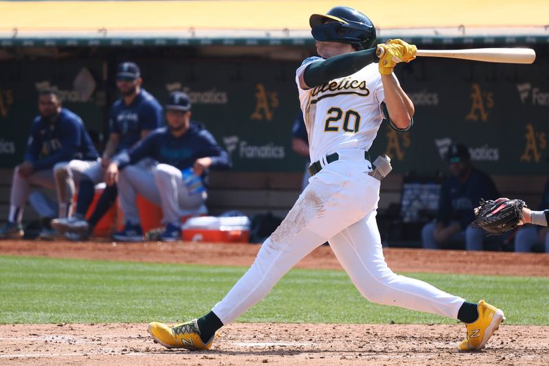 Sep 20, 2023; Oakland, California, USA; Oakland Athletics second baseman Zack Gelof (20) hits a home run against the Seattle Mariners during the fourth inning at Oakland-Alameda County Coliseum. Mandatory Credit: Kelley L Cox-USA TODAY Sports