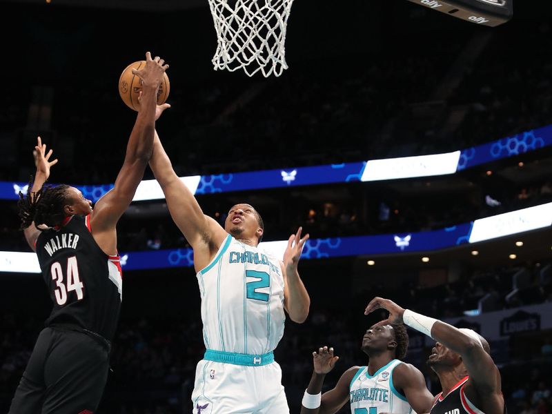 CHARLOTTE, NC - APRIL 3:  Grant Williams #2 of the Charlotte Hornets  and Jabari Walker #34 of the Portland Trail Blazers battle for a rebound on April 3, 2024 at Spectrum Center in Charlotte, North Carolina. NOTE TO USER: User expressly acknowledges and agrees that, by downloading and or using this photograph, User is consenting to the terms and conditions of the Getty Images License Agreement.  Mandatory Copyright Notice:  Copyright 2024 NBAE (Photo by Brock Williams-Smith/NBAE via Getty Images)