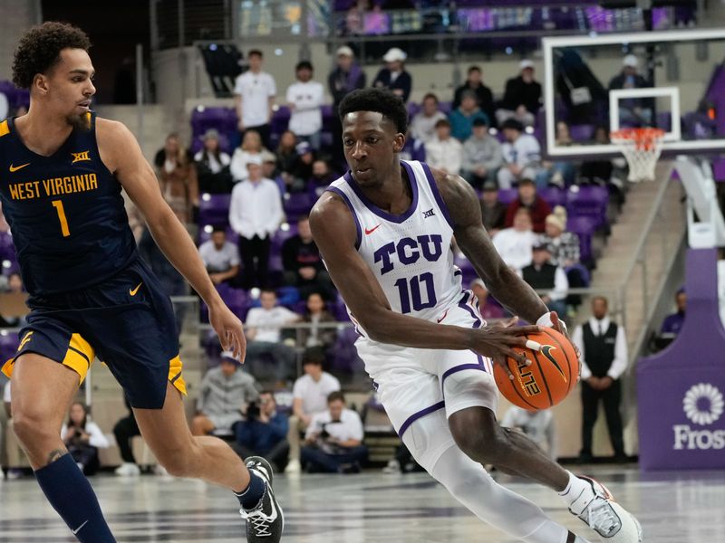 Jan 31, 2023; Fort Worth, Texas, USA; TCU Horned Frogs guard Damion Baugh (10) drives to the basket as West Virginia Mountaineers forward Emmitt Matthews Jr. (1) defends during the first half at Ed and Rae Schollmaier Arena. Mandatory Credit: Chris Jones-USA TODAY Sports