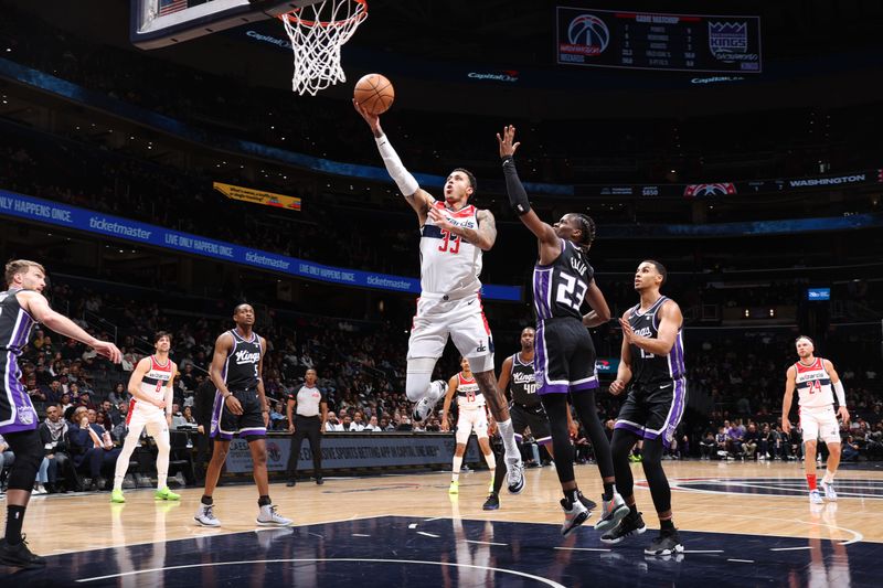 WASHINGTON, DC -? MARCH 21: Kyle Kuzma #33 of the Washington Wizards drives to the basket during the game against the Sacramento Kings on March 21, 2024 at Capital One Arena in Washington, DC. NOTE TO USER: User expressly acknowledges and agrees that, by downloading and or using this Photograph, user is consenting to the terms and conditions of the Getty Images License Agreement. Mandatory Copyright Notice: Copyright 2024 NBAE (Photo by Stephen Gosling/NBAE via Getty Images)