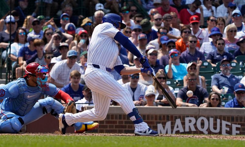 Aug 3, 2024; Chicago, Illinois, USA; Chicago Cubs first baseman Michael Busch (29) hits a single against the St. Louis Cardinals during the fifth inning at Wrigley Field. Mandatory Credit: David Banks-USA TODAY Sports