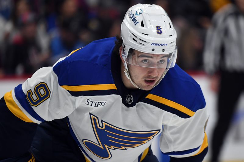 Jan 31, 2025; Denver, Colorado, USA; St. Louis Blues center Alexandre Texier (9) waits for a face off during the first period against the Colorado Avalanche at Ball Arena. Mandatory Credit: Christopher Hanewinckel-Imagn Images