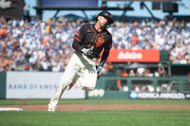 Jun 29, 2024; San Francisco, California, USA; San Francisco Giants shortstop Nick Ahmed (16) rounds third base on his way to score against the Los Angeles Dodgers during the third inning at Oracle Park. Mandatory Credit: Ed Szczepanski-USA TODAY Sports