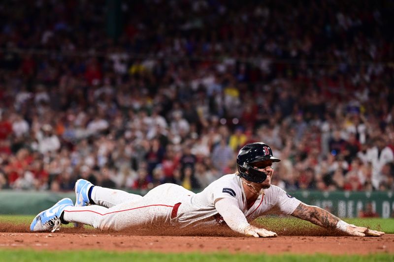 iJun 16, 2024; Boston, Massachusetts, USA; Boston Red Sox left fielder Jarren Duran (16)  slides into third base during the seventh inning against the New York Yankees at Fenway Park. Mandatory Credit: Eric Canha-USA TODAY Sports