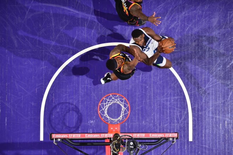 PHOENIX, AZ - APRIL 4: Anthony Edwards #5 of the Minnesota Timberwolves drives to the basket during the game against the Phoenix Suns during Round 1 Game 4 of the 2024 NBA Playoffs on April 4, 2023 at Footprint Center in Phoenix, Arizona. NOTE TO USER: User expressly acknowledges and agrees that, by downloading and or using this photograph, user is consenting to the terms and conditions of the Getty Images License Agreement. Mandatory Copyright Notice: Copyright 2024 NBAE (Photo by Barry Gossage/NBAE via Getty Images)