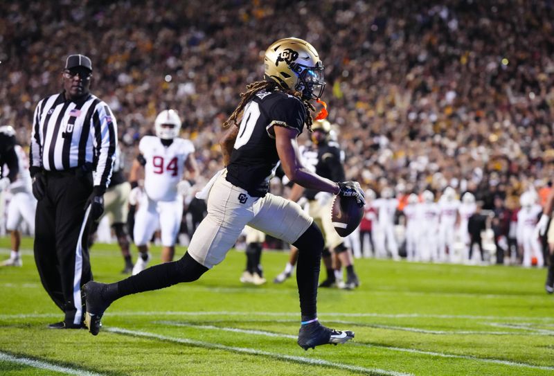 Oct 13, 2023; Boulder, Colorado, USA; Colorado Buffaloes wide receiver Xavier Weaver (10) pulls in a touchdown in the first quarter against the Stanford Cardinal at Folsom Field. Mandatory Credit: Ron Chenoy-USA TODAY Sports