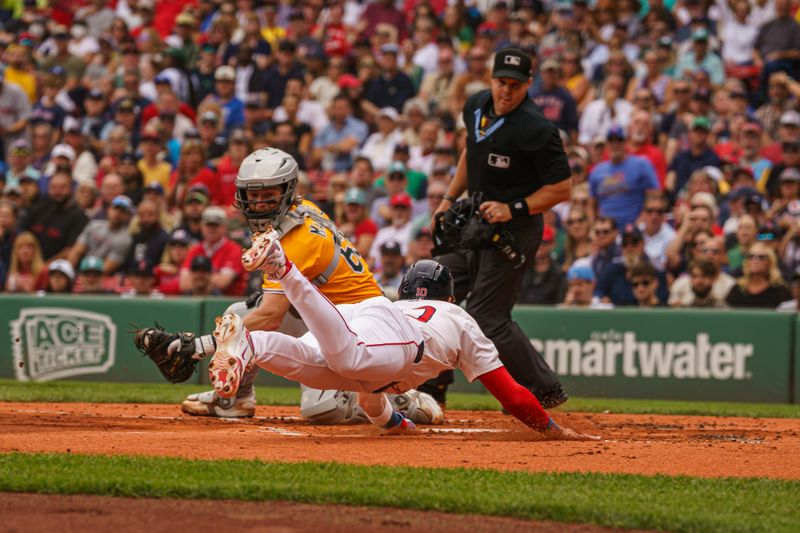 Sep 18, 2025; Boston, Massachusetts, USA; Boston Red Sox shortstop Trevor Story (10) scores on a sacrifice out against Athletics catcher Willie MacIver (65) in the first inning at Fenway Park. Mandatory Credit: David Butler II-Imagn Images