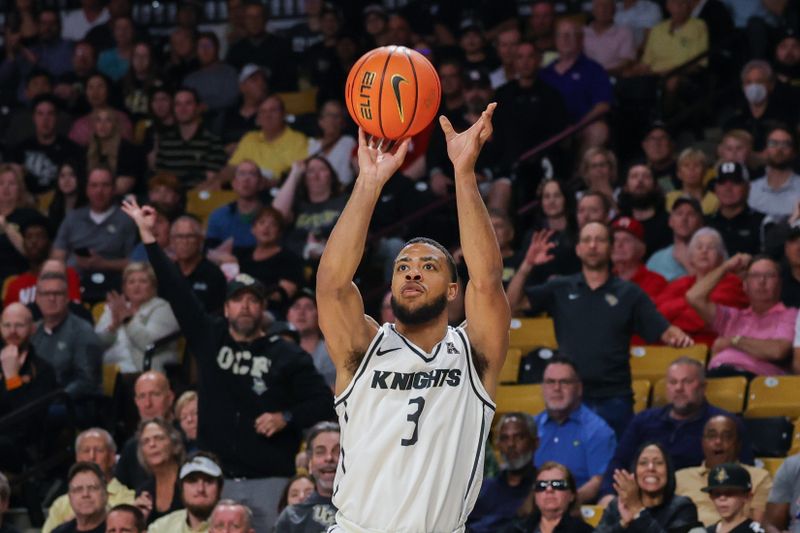 Jan 25, 2023; Orlando, Florida, USA; UCF Knights guard Darius Johnson (3) shoots the ball during the first half against the Houston Cougars at Addition Financial Arena. Mandatory Credit: Mike Watters-USA TODAY Sports