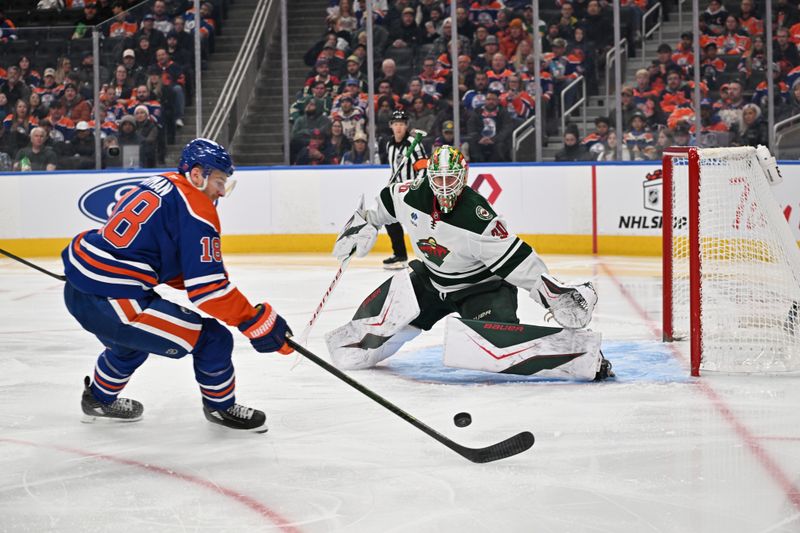 Dec 2, 2025; Edmonton, Alberta, CAN; Edmonton Oilers left wing Zach Hyman (18) goes for the puck in front of Minnesota Wild goalie Jesper Wallstedt (30) during the third period at Rogers Place. Mandatory Credit: Walter Tychnowicz-Imagn Images