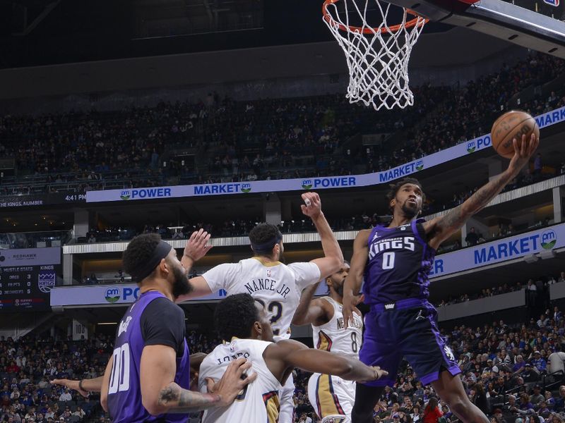 SACRAMENTO, CA - JANUARY 7:  Malik Monk #0 of the Sacramento Kings goes to the basket during the game on January 7, 2024 at Golden 1 Center in Sacramento, California. NOTE TO USER: User expressly acknowledges and agrees that, by downloading and or using this Photograph, user is consenting to the terms and conditions of the Getty Images License Agreement. Mandatory Copyright Notice: Copyright 2024 NBAE (Photo by Rocky Widner/NBAE via Getty Images)