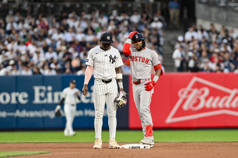 Jun 8, 2025; Bronx, New York, USA; Boston Red Sox outfielder Ceddanne Rafaela (3) advances to second after a throwing error by New York Yankees second baseman Jazz Chisholm Jr. (13) during the third inning at Yankee Stadium. Mandatory Credit: John Jones-Imagn Images