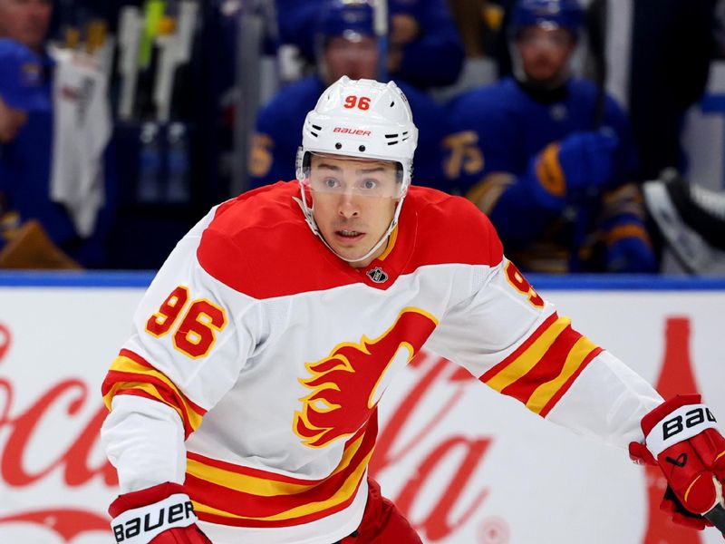 Nov 9, 2024; Buffalo, New York, USA;  Calgary Flames left wing Andrei Kuzmenko (96) looks for the puck during the first period against the Buffalo Sabres at KeyBank Center. Mandatory Credit: Timothy T. Ludwig-Imagn Images