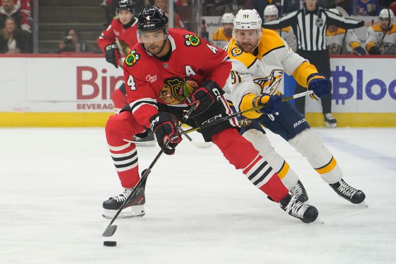 Oct 25, 2024; Chicago, Illinois, USA; Nashville Predators center Steven Stamkos (91) defends against Chicago Blackhawks defenseman Wyatt Kaiser (44) during the first period at the United Center. Mandatory Credit: David Banks-Imagn Images