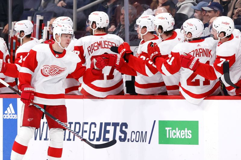 Dec 20, 2023; Winnipeg, Manitoba, CAN; Detroit Red Wings defenseman Olli Maatta (2) celebrates his second period goal against the Winnipeg Jets at Canada Life Centre. Mandatory Credit: James Carey Lauder-USA TODAY Sports