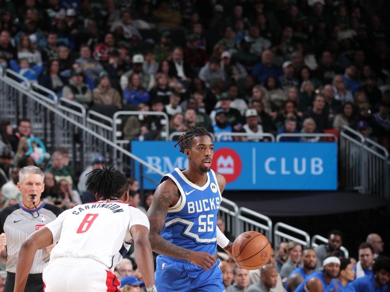 MILWAUKEE, WI - NOVEMBER 30: Delon Wright #55 of the Milwaukee Bucks dribbles the ball during the game against the Washington Wizards on November 30, 2024 at Fiserv Forum Center in Milwaukee, Wisconsin. NOTE TO USER: User expressly acknowledges and agrees that, by downloading and or using this Photograph, user is consenting to the terms and conditions of the Getty Images License Agreement. Mandatory Copyright Notice: Copyright 2024 NBAE (Photo by Gary Dineen/NBAE via Getty Images).