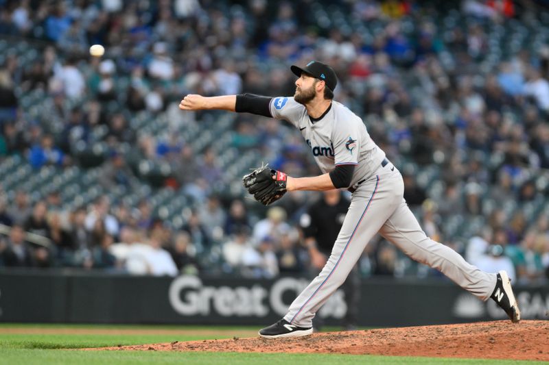 Jun 14, 2023; Seattle, Washington, USA; Miami Marlins relief pitcher Dylan Floro (36) pitches to the Seattle Mariners during the seventh inning at T-Mobile Park. Mandatory Credit: Steven Bisig-USA TODAY Sports