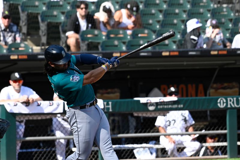 Aug 23, 2023; Chicago, Illinois, USA;  Seattle Mariners first baseman Ty France (23) hits a two RBI single against the Chicago White Sox during the ninth inning at Guaranteed Rate Field. Mandatory Credit: Matt Marton-USA TODAY Sports