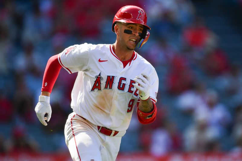 May 1, 2024; Anaheim, California, USA; Los Angeles Angels shortstop Zach Neto (9) runs after hitting a single against the Philadelphia Phillies during the ninth inning at Angel Stadium. Mandatory Credit: Gary A. Vasquez-USA TODAY Sports
