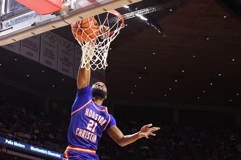 Dec 29, 2025; Ames, Iowa, USA; Houston Christian Huskies forward Mambourou Mara (21) dunks against the Iowa State Cyclones during the second half at James H. Hilton Coliseum. Mandatory Credit: Reese Strickland-Imagn Images