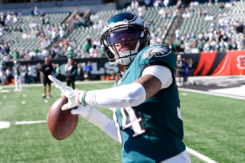 Philadelphia Eagles cornerback Isaiah Rodgers tosses the ball to spectators prior to an NFL football game against the Cincinnati Bengals, Sunday, Oct. 27, 2024 in Cincinnati. (AP Photo/Carolyn Kaster)