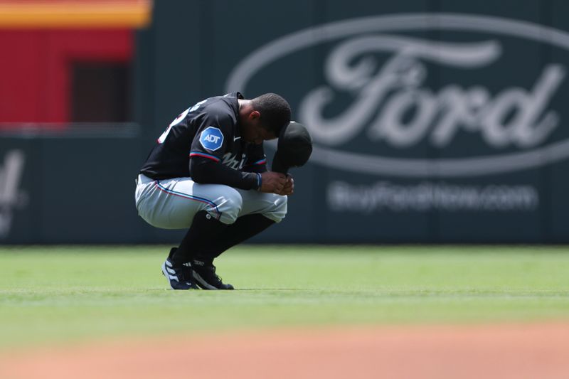 Aug 4, 2024; Cumberland, Georgia, USA; Miami Marlins shortstop Xavier Edwards (63) takes a moment before a game against the Atlanta Braves at Truist Park. Mandatory Credit: Mady Mertens-USA TODAY Sports