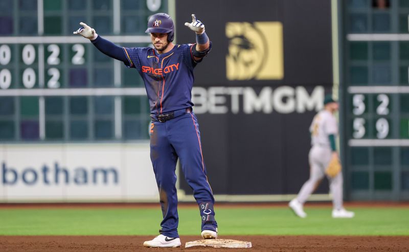 May 13, 2024; Houston, Texas, USA; Houston Astros third baseman Alex Bregman (2) reacts after hitting a two run RBI double against the Oakland Athletics in the eighth inning at Minute Maid Park. Mandatory Credit: Thomas Shea-USA TODAY Sports