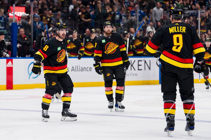 Nov 6, 2023; Vancouver, British Columbia, CAN; Vancouver Canucks forward Conor Garland (8), defenseman Filip Hronek (17), and forward J.T. Miller (9) celebrate Miller   s goal against the Edmonton Oilers in the third period at Rogers Arena. Vancouver won 6-2. Mandatory Credit: Bob Frid-USA TODAY Sports