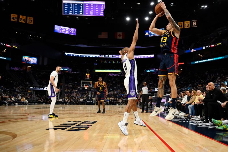 SAN FRANCISCO, CALIFORNIA - JANUARY 05: Lindy Waters III #43 of the Golden State Warriors shoots a three point basket over Jordan McLaughlin #3 of the Sacramento Kings in the fourth quarter at Chase Center on January 05, 2025 in San Francisco, California. NOTE TO USER: User expressly acknowledges and agrees that, by downloading and or using this photograph, User is consenting to the terms and conditions of the Getty Images License Agreement. (Photo by Eakin Howard/Getty Images)