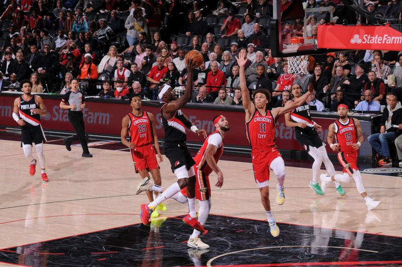 PORTLAND, OR - APRIL 9: Duop Reath #26 of the Portland Trail Blazers shoots the ball during the game against the New Orleans Pelicans on April 9, 2024 at the Moda Center Arena in Portland, Oregon. NOTE TO USER: User expressly acknowledges and agrees that, by downloading and or using this photograph, user is consenting to the terms and conditions of the Getty Images License Agreement. Mandatory Copyright Notice: Copyright 2024 NBAE (Photo by Cameron Browne/NBAE via Getty Images)