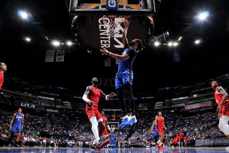 ORLANDO, FL - APRIL 1: Jalen Suggs #4 of the Orlando Magic drives to the basket during the game against the Portland Trail Blazers on April 1, 2024 at Kia Center in Orlando, Florida. NOTE TO USER: User expressly acknowledges and agrees that, by downloading and or using this photograph, User is consenting to the terms and conditions of the Getty Images License Agreement. Mandatory Copyright Notice: Copyright 2024 NBAE (Photo by Fernando Medina/NBAE via Getty Images)