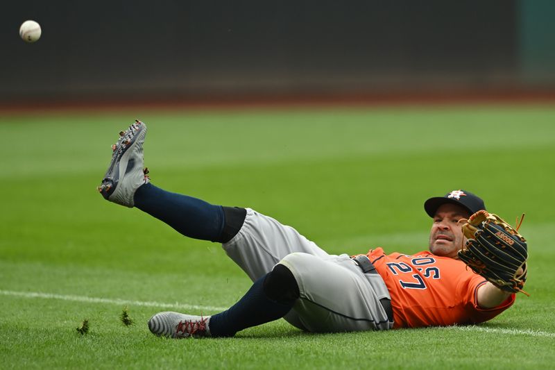 Jun 7, 2025; Cleveland, Ohio, USA; Houston Astros left fielder Jose Altuve (27) fails to catch a ball hit by Cleveland Guardians left fielder Steven Kwan (not pictured) during the ninth inning at Progressive Field. Mandatory Credit: Ken Blaze-Imagn Images