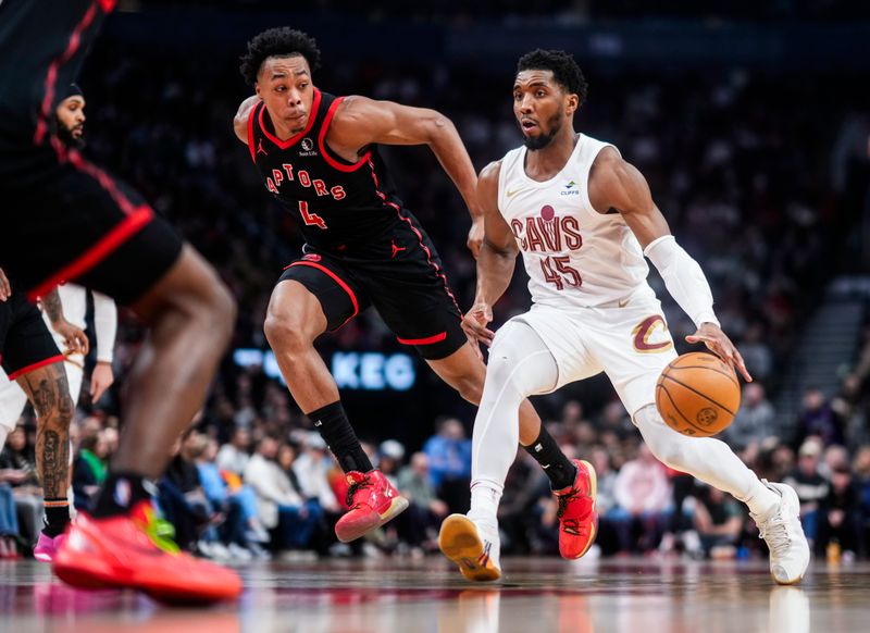 TORONTO, ON - FEBRUARY 10: Donovan Mitchell #45 of the Cleveland Cavaliers dribbles against Scottie Barnes #4 of the Toronto Raptors during the first half of their basketball game at the Scotiabank Arena on February 10, 2024 in Toronto, Ontario, Canada. NOTE TO USER: User expressly acknowledges and agrees that, by downloading and/or using this Photograph, user is consenting to the terms and conditions of the Getty Images License Agreement. (Photo by Mark Blinch/Getty Images)