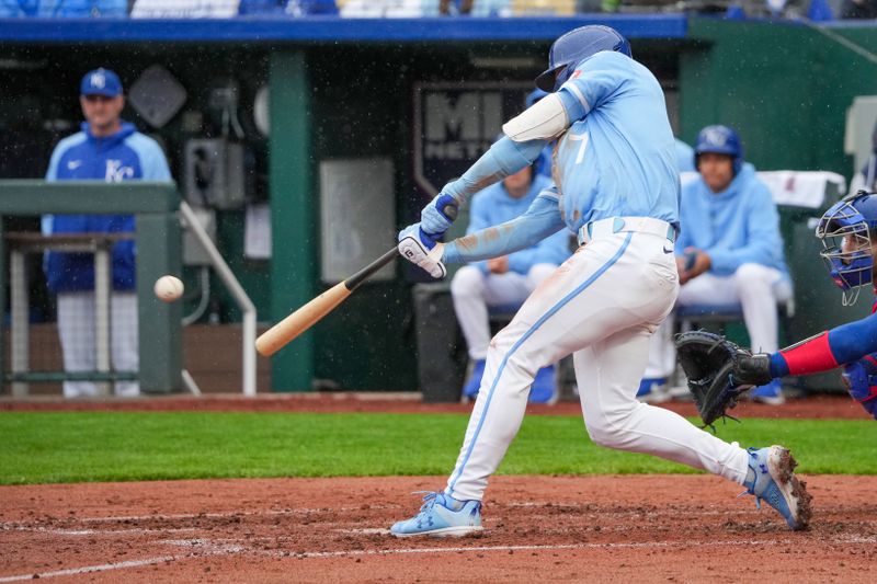 May 5, 2024; Kansas City, Missouri, USA; Kansas City Royals shortstop Bobby Witt Jr. (7) hits a double against the Texas Rangers in the third inning at Kauffman Stadium. Mandatory Credit: Denny Medley-USA TODAY Sports