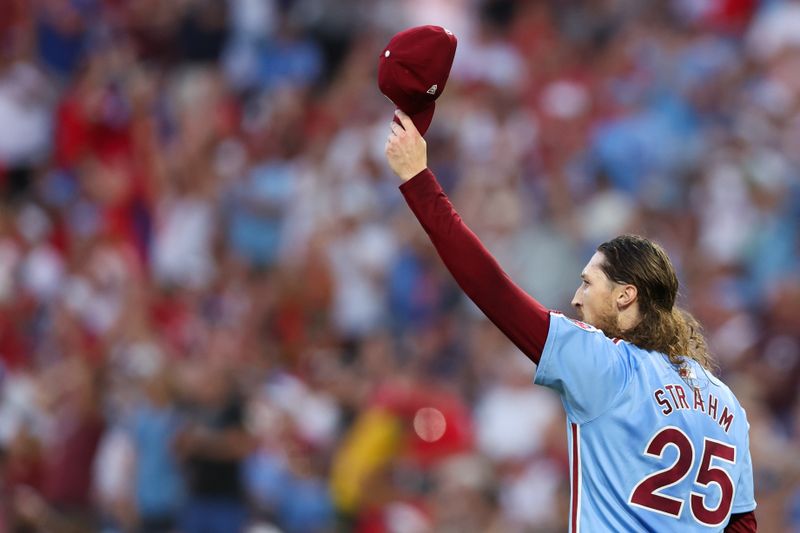 Jul 11, 2024; Philadelphia, Pennsylvania, USA; Philadelphia Phillies pitcher Matt Strahm (25) reacts to an acrobatic catch for an out by outfielder Johan Rojas (not pictured) during the seventh inning against the Los Angeles Dodgers at Citizens Bank Park. Mandatory Credit: Bill Streicher-USA TODAY Sports