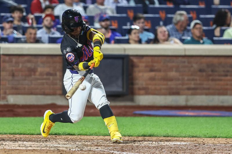 Sep 19, 2024; New York City, New York, USA;  New York Mets shortstop Luisangel Acuña (2) hits an RBI triple in the seventh inning against the Philadelphia Phillies at Citi Field. Mandatory Credit: Wendell Cruz-Imagn Images