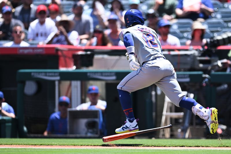 Aug 4, 2024; Anaheim, California, USA; New York Mets shortstop Francisco Lindor (12) runs to first base against the Los Angeles Angels during the first inning at Angel Stadium. Mandatory Credit: Jonathan Hui-USA TODAY Sports