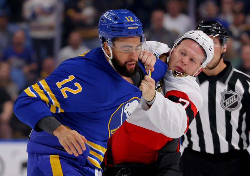 Nov 5, 2024; Buffalo, New York, USA;  Ottawa Senators left wing Brady Tkachuk (7) and Buffalo Sabres left wing Jordan Greenway (12) fight during the first period at KeyBank Center. Mandatory Credit: Timothy T. Ludwig-Imagn Images